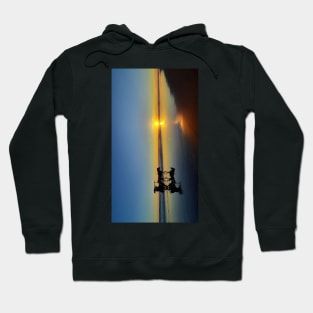 A silhouetted horse-drawn carriage on Parangtritis beach at sunset 1v Hoodie